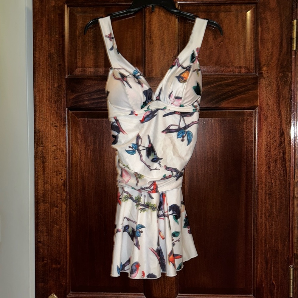 Woman’s one piece bird bathing suit  Used condition.